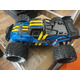 Швидкісна машинка на радіокеруванні 1:16 4WD 40 км/год: Позашляховий монстр-трак 4х4, 2 акумулятори, 2.4 ГГц, Б/У